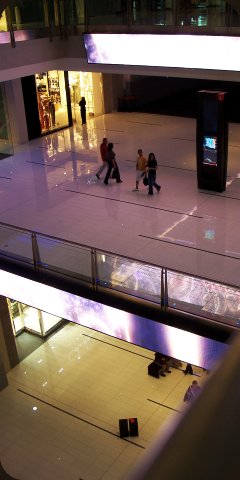 A typical hallway in Dubai Mall, with vast spaces over several levels and colourful LED screens everywhere
