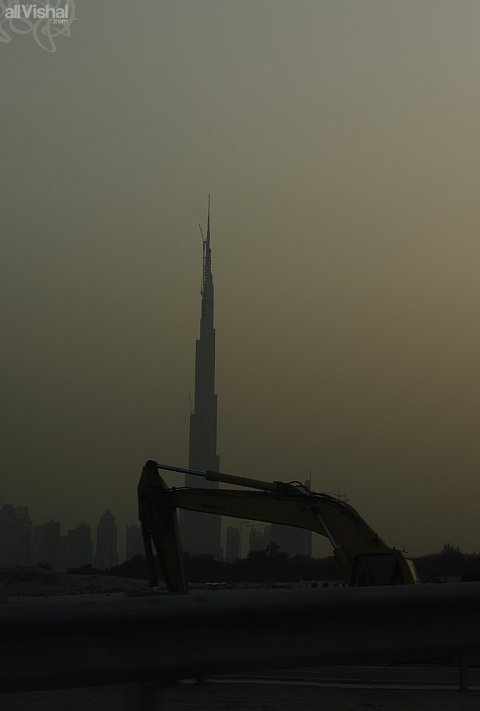 The Burj Dubai, tallest building in the world, and an earth scooper in the foreground