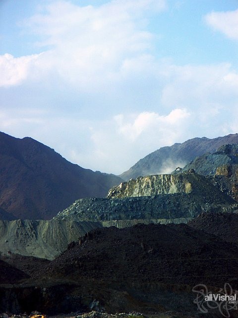Dust rises from a quarroied mountain in Fujairah