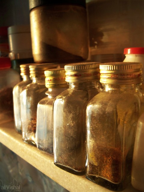 A rack of small spice bottles