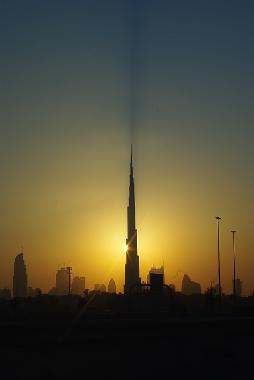the sunset behind the burj khalifa