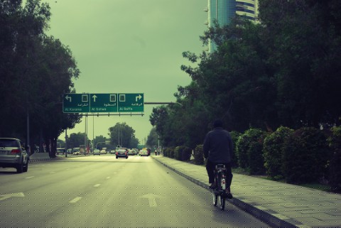 A cyclist makes his way along Mankhool road, Bur Dubai