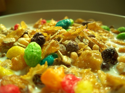 Photo of a bowl of colourful breakfast cereal with milk