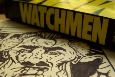 A TPB of Watchmen next sitting on a page drawn by me